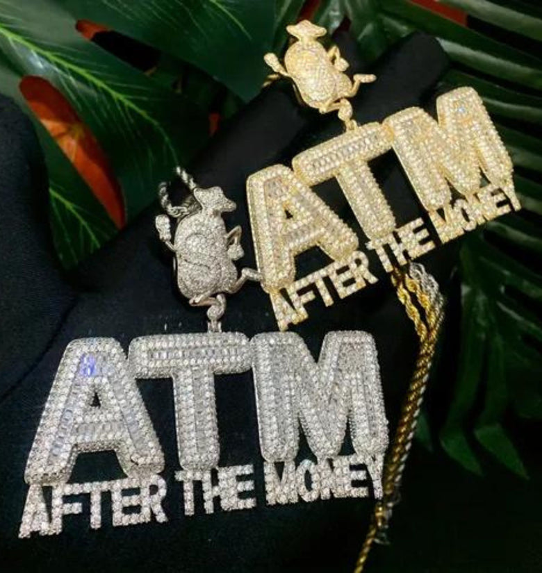 a gold and silver jewelry on a black cloth