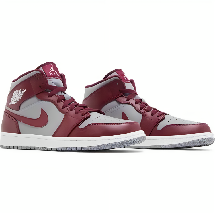 a pair of maroon and white sneakers
