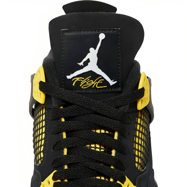 a close up of a black and yellow shoe