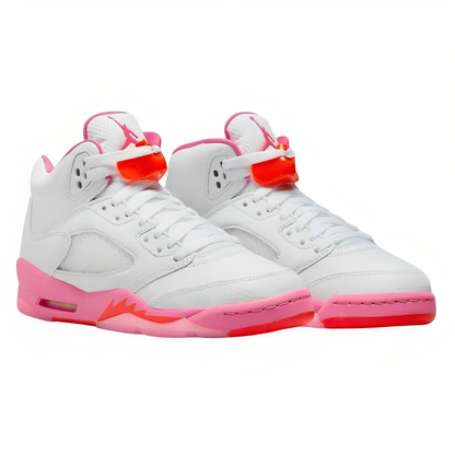 a pair of white and pink sneakers