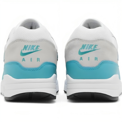 a pair of white and blue sneakers
