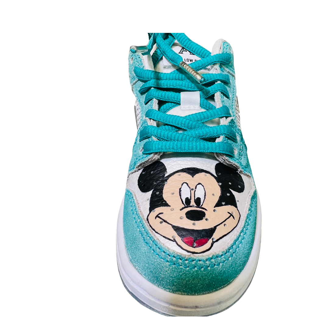 a blue and white shoe with a cartoon character on it