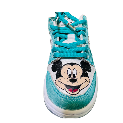 a blue and white shoe with a cartoon character on it