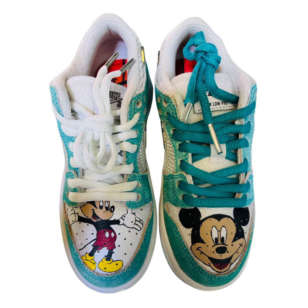 a pair of shoes with cartoon characters on them