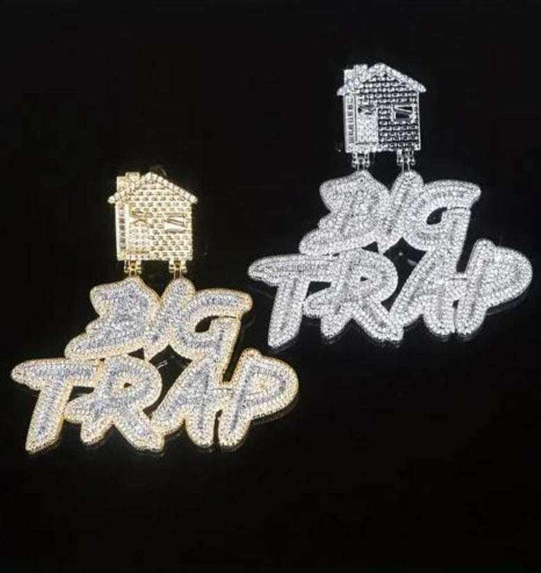 a pair of brooches with words