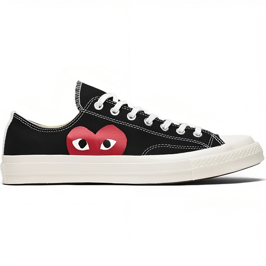 a black and white shoe with a red heart on it