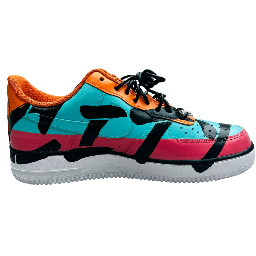 a colorful shoe with black and orange paint