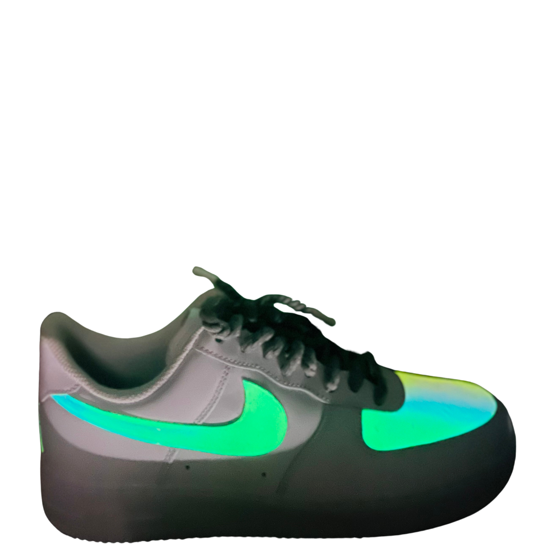 a white and green nike air force sneakers