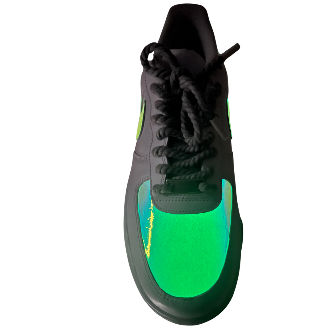 a green sneakers with black laces