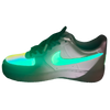 a white and green nike air force sneakers