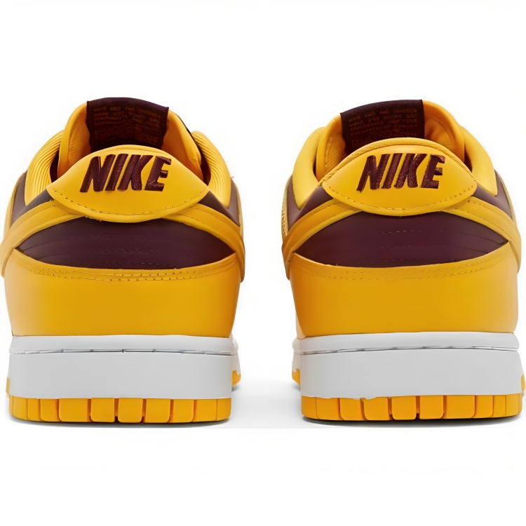 a pair of yellow and maroon sneakers
