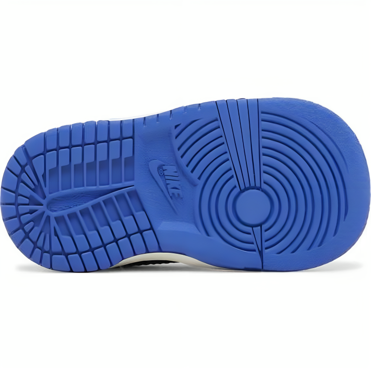 the bottom of a blue and white shoe