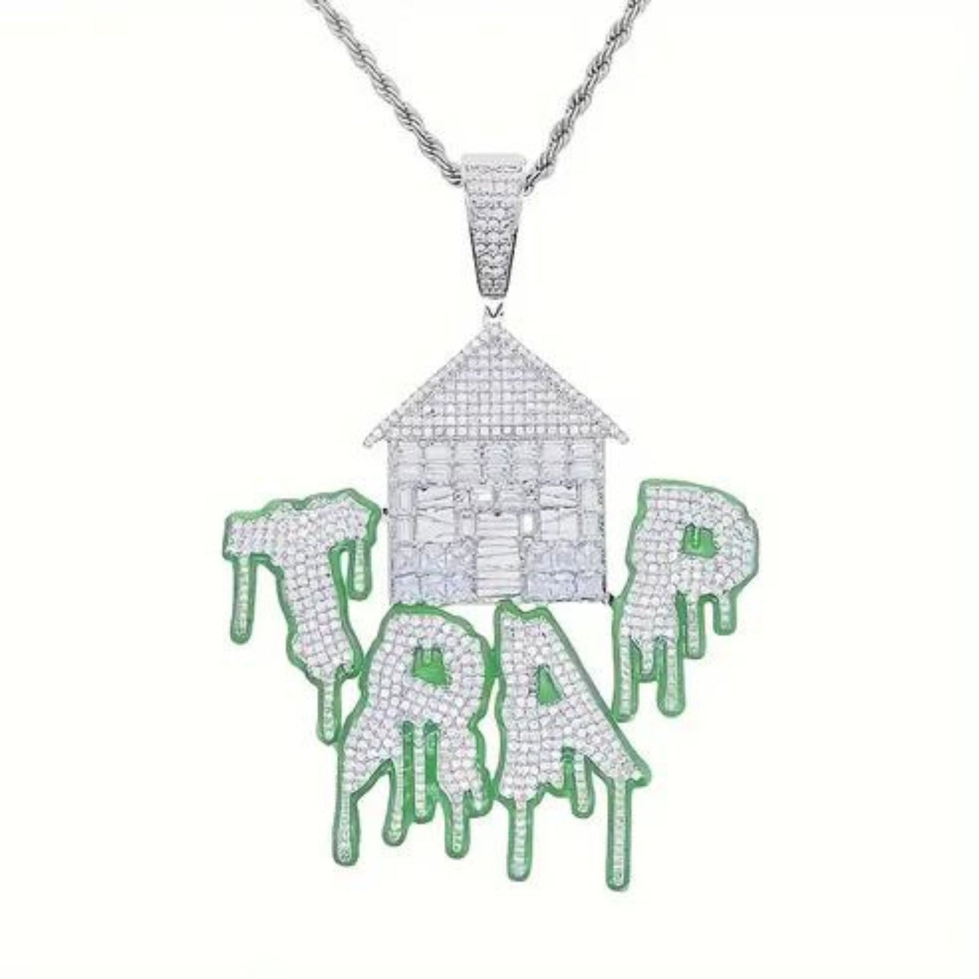 a necklace with a house and dripping paint