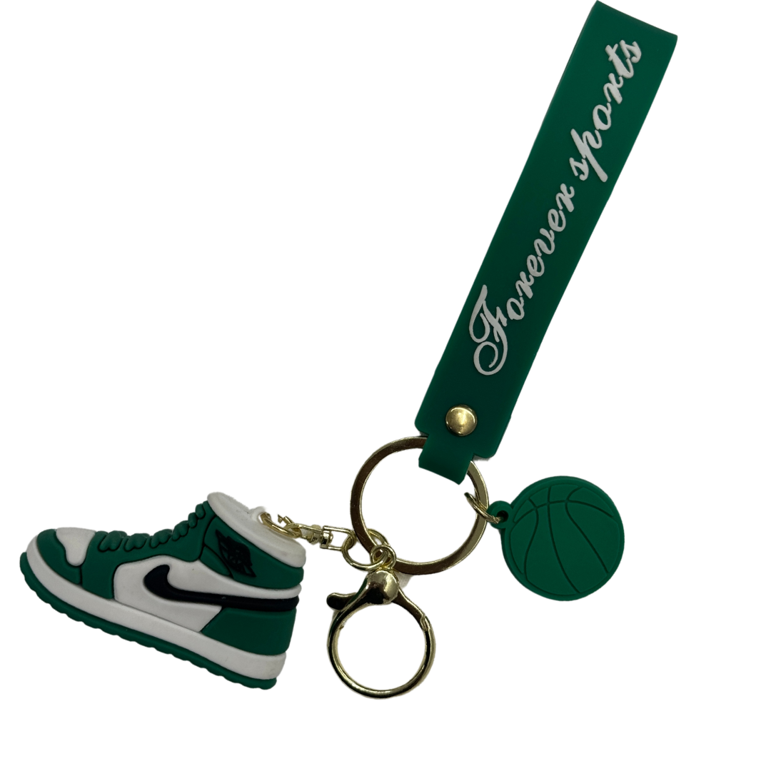 a green and white shoe keychain 