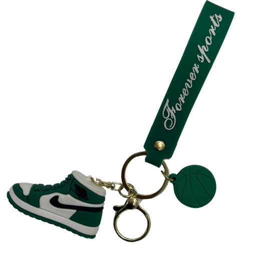 a green and white shoe keychain 