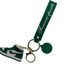 a green and white shoe keychain 