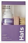 a purple box with a white label and a bottle of hair care kit