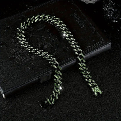 a green necklace on a book