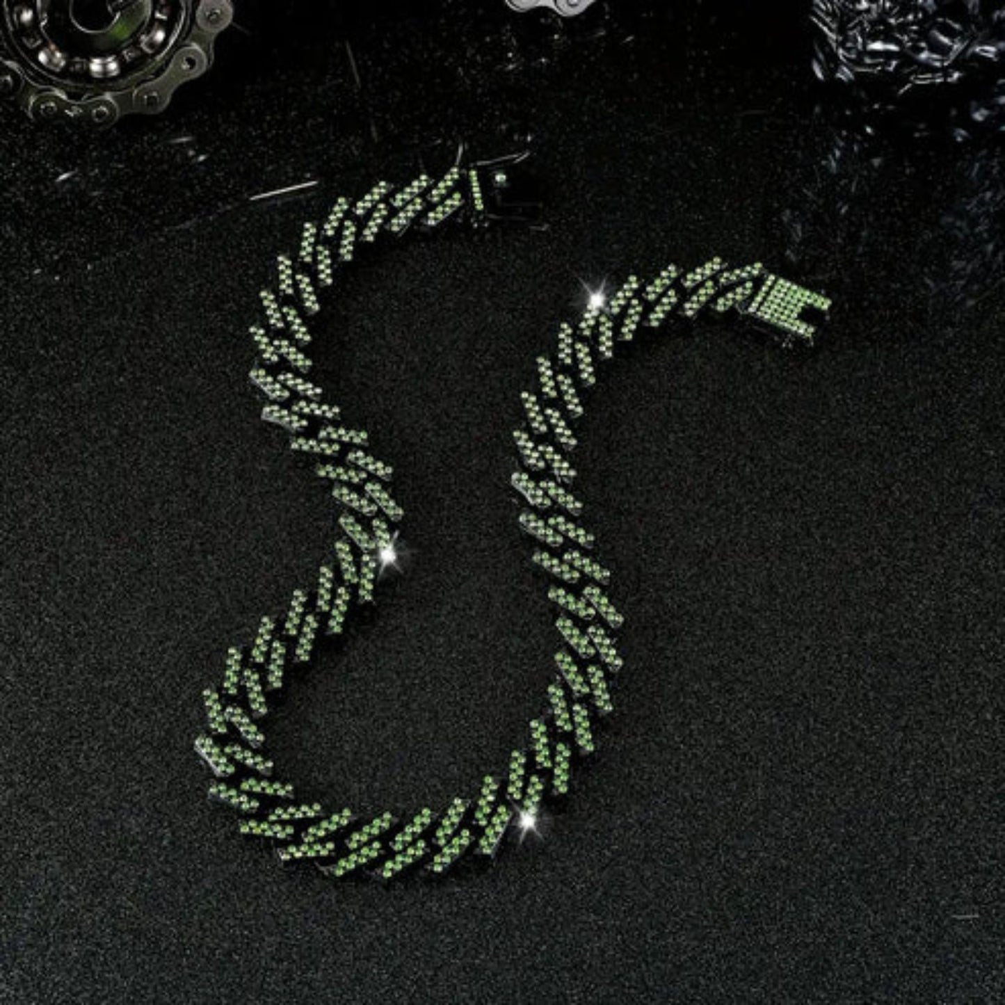 a green necklace on a black surface