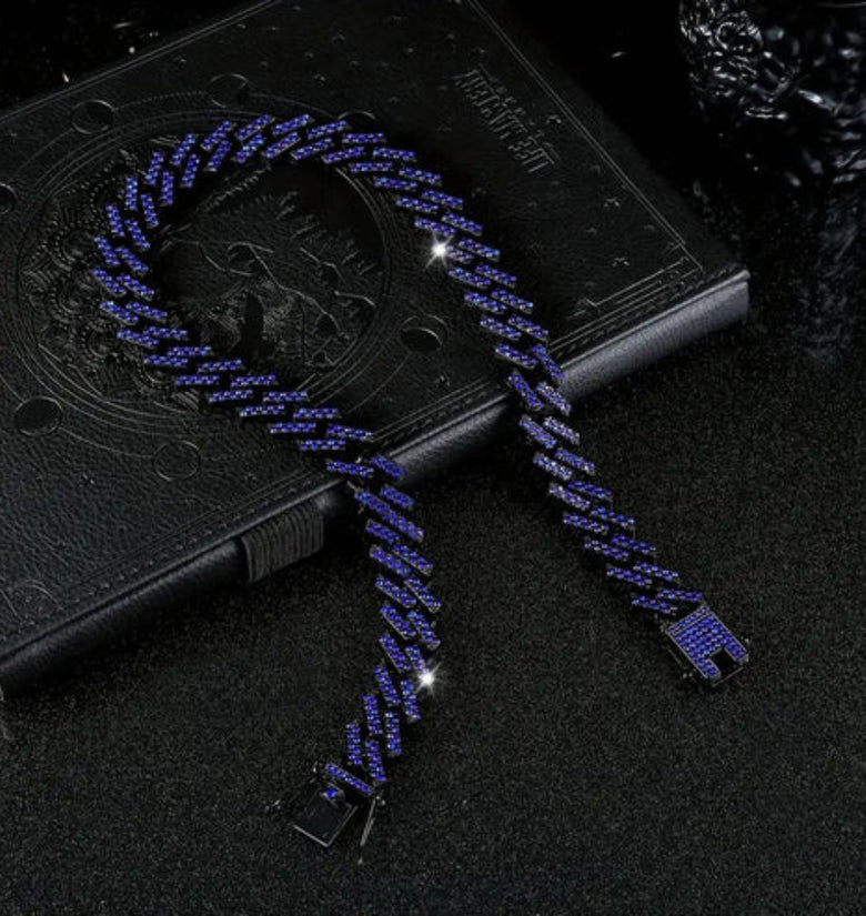 a blue necklace on a book