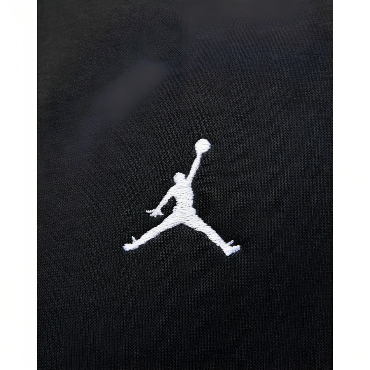 a logo of a person jumping for a ball