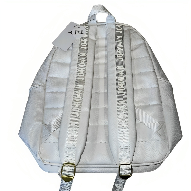a white backpack with straps