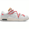 a white shoe with pink laces