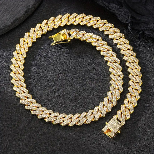 a gold necklace on black surface