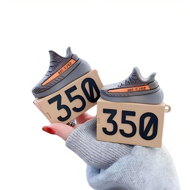 a person holding a pair of boxes with shoes