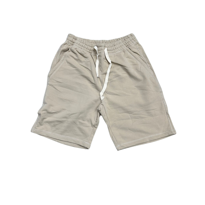a beige color shorts with a white drawstring on the side