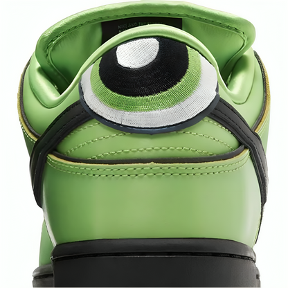 a green shoe with a cartoon eye patch