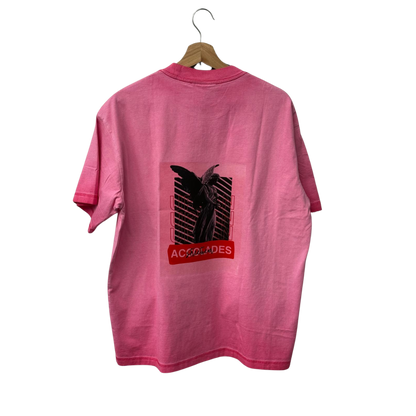 a pink shirt with a black background