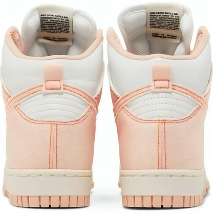 a close up of a pair of pink and white sneakers