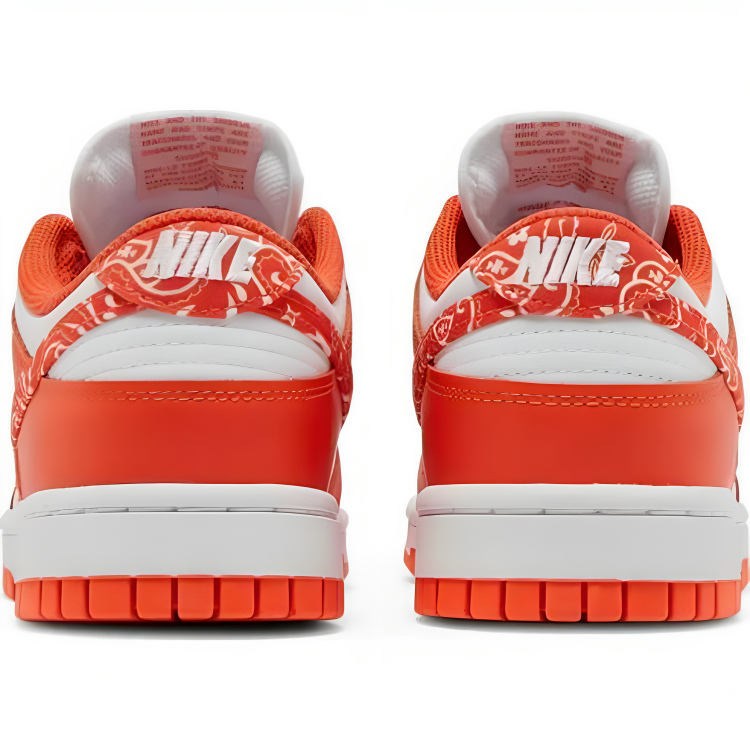 a pair of orange and white sneakers