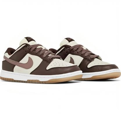 a pair of brown and white sneakers
