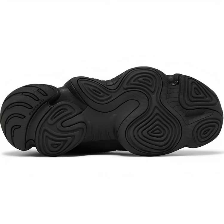 a black shoe with black soles