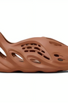 a brown shoe with holes