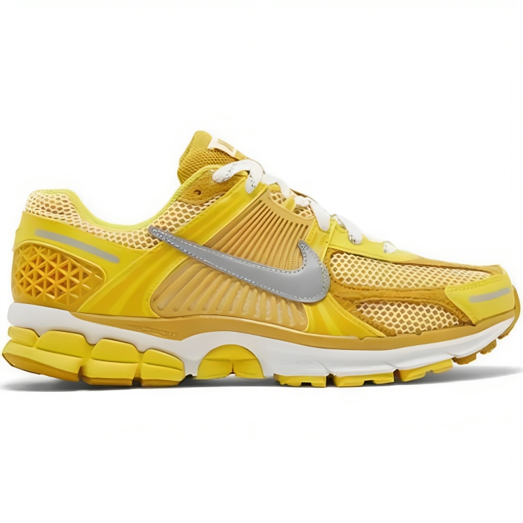 a yellow and white running shoe