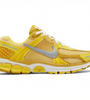 a yellow and white running shoe